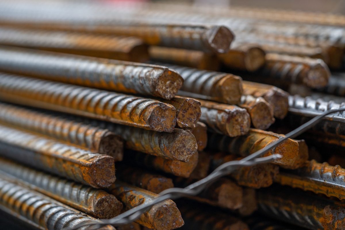 Stacked of rusty metal steel rods on the construction site A stacked of rusty metal steel rods on the construction site